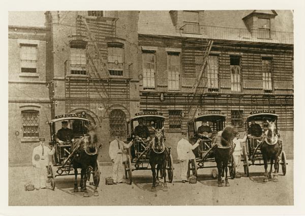 Horse-drawn Bellevue Hospital ambulances with attendants